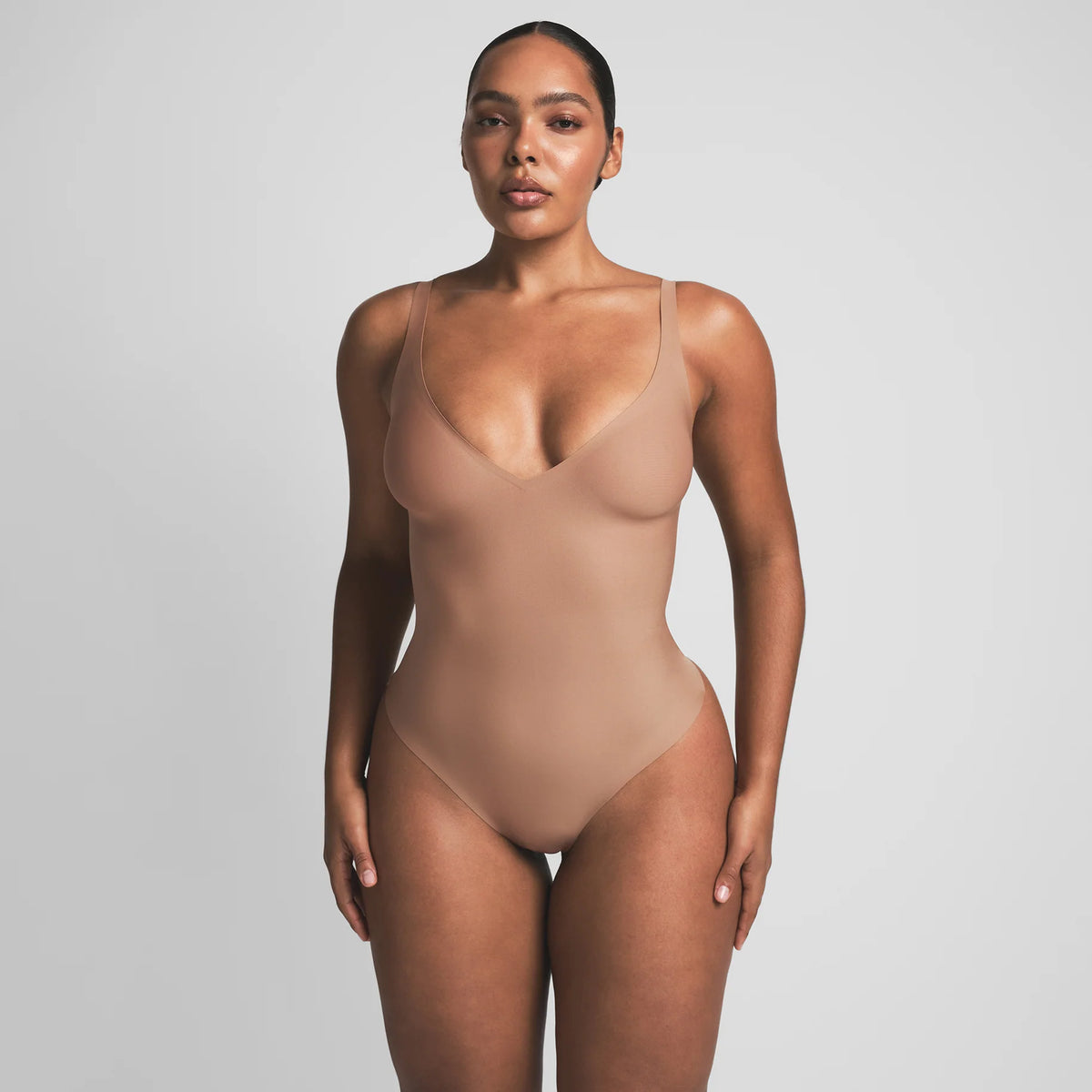 SKIMS BODY UNLINED PLUNGE THONG BODYSUIT | SIENNA