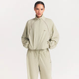 NikeSKIMS STRETCH NYLON OVERSIZED TRACK JACKET | TALC